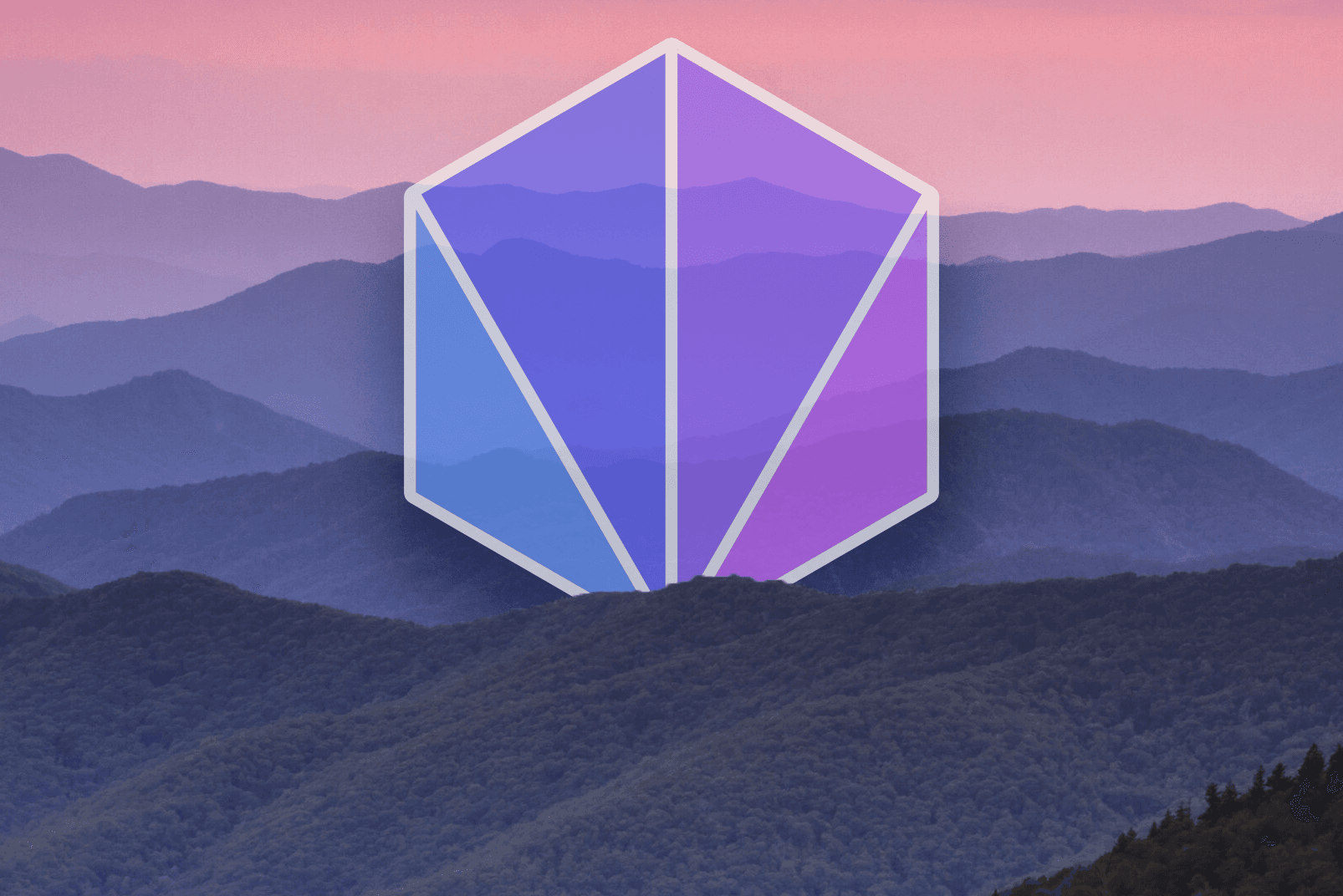 prism logomark over a blue ridge sunset